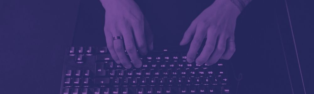 Hands typing at a keyboard