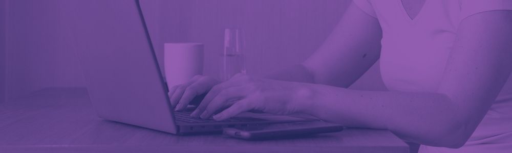 A women typing on a laptop